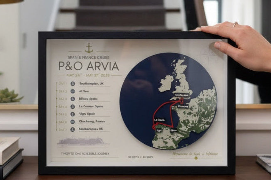 Framed 3D cruise map keepsake displayed on a wooden console table