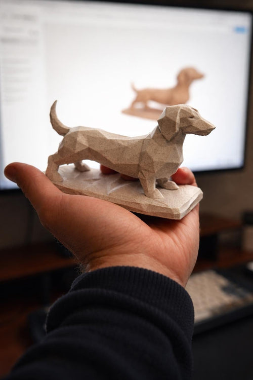 Geometric marble-effect dachshund sculpture on a desk